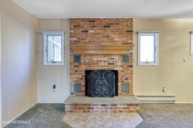 unfurnished living room with a baseboard heating unit, carpet floors, and a brick fireplace