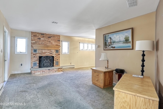 carpeted living room featuring a fireplace, baseboard heating, and plenty of natural light