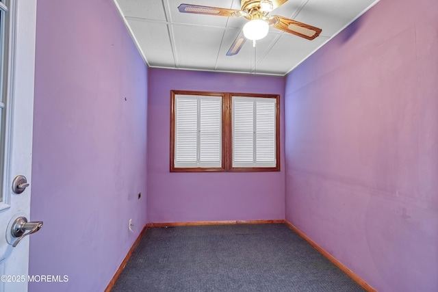 carpeted empty room featuring ceiling fan