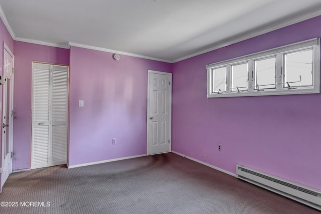 spare room featuring a baseboard radiator, crown molding, and carpet flooring