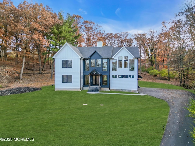 view of front of home with a front yard