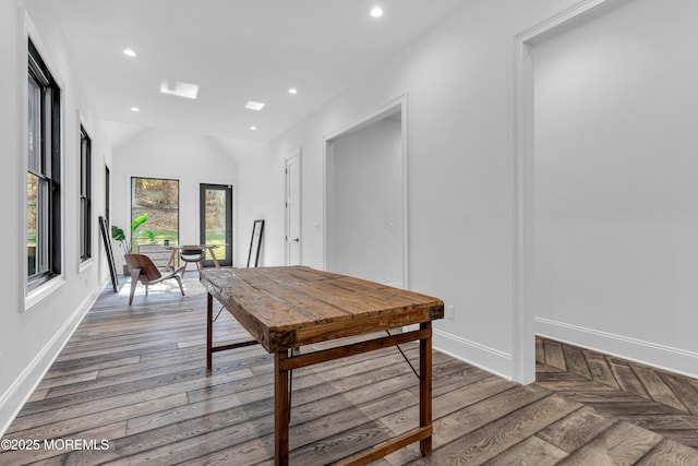 dining space with wood-type flooring