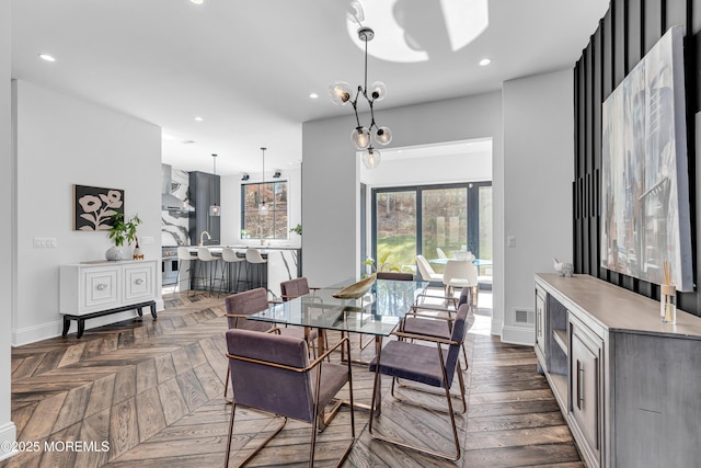 dining area with dark parquet flooring