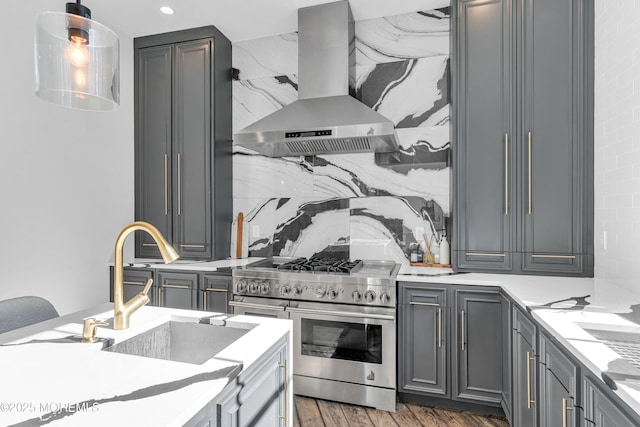 kitchen with dark hardwood / wood-style flooring, range with two ovens, gray cabinetry, and island range hood