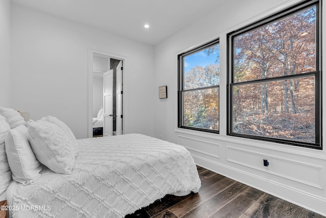 bedroom featuring dark hardwood / wood-style flooring