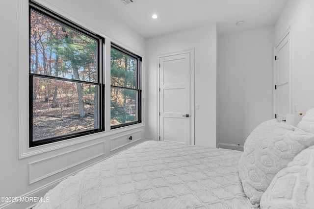 bedroom with multiple windows