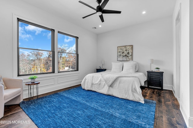 bedroom with dark wood-type flooring and ceiling fan