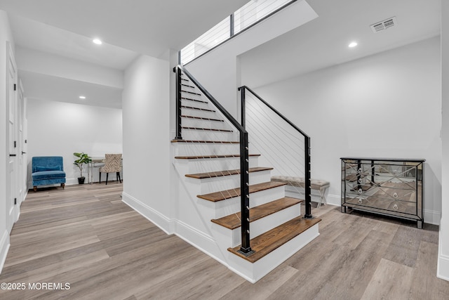 stairway with wood-type flooring