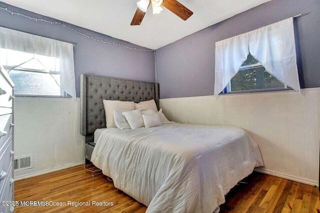 bedroom featuring hardwood / wood-style flooring and ceiling fan