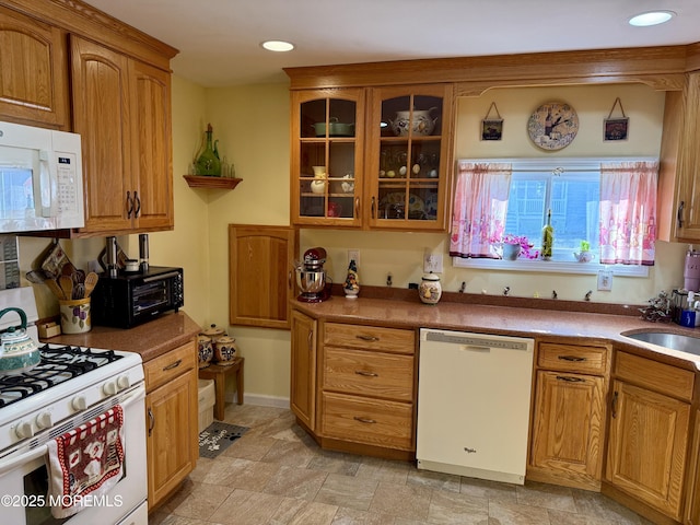 kitchen with sink and white appliances