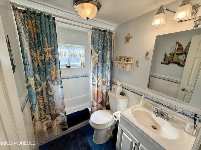 full bathroom with toilet, tile walls, shower / bath combo, and vanity