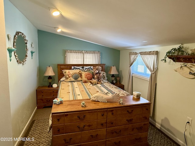 carpeted bedroom featuring vaulted ceiling