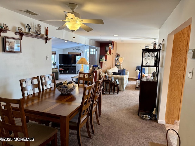 dining room featuring carpet floors and ceiling fan