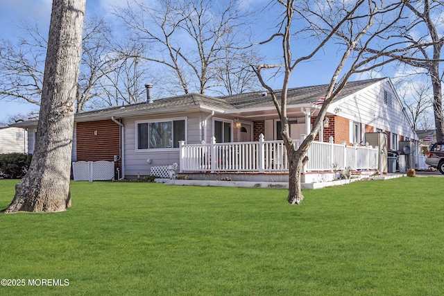 view of front of home with covered porch and a front yard