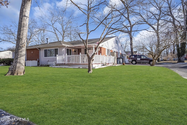 view of front of house with covered porch and a front yard