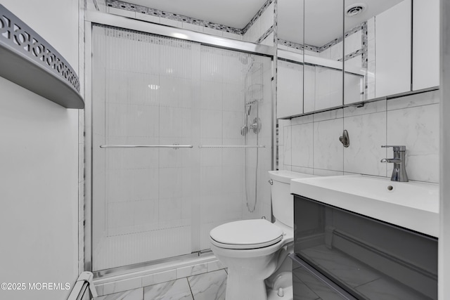 bathroom with vanity, an enclosed shower, tile walls, and backsplash