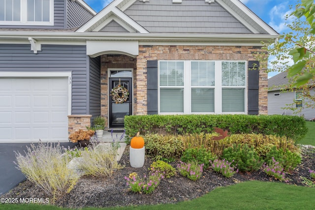 doorway to property with a garage