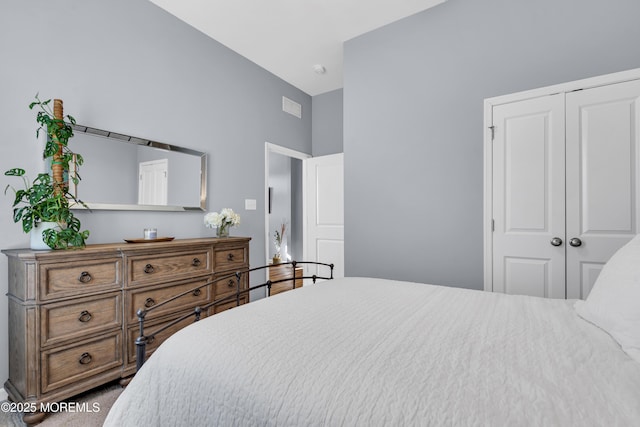 bedroom with a closet and carpet flooring