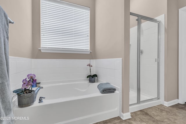 bathroom with shower with separate bathtub