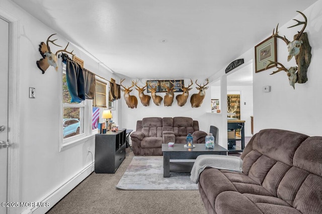 carpeted living room featuring a baseboard heating unit