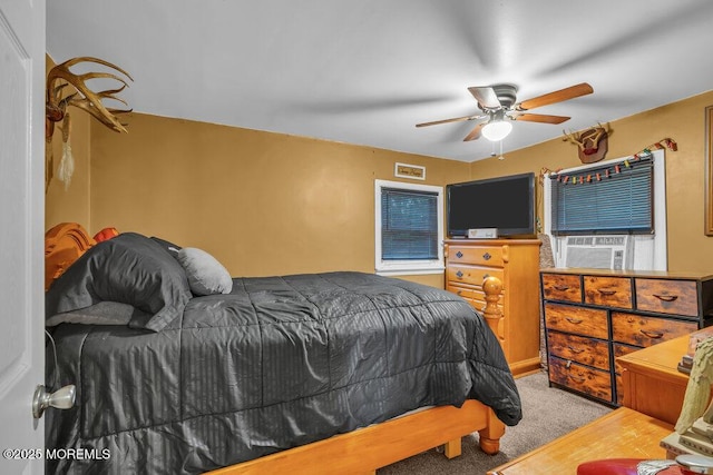 bedroom with ceiling fan and light colored carpet