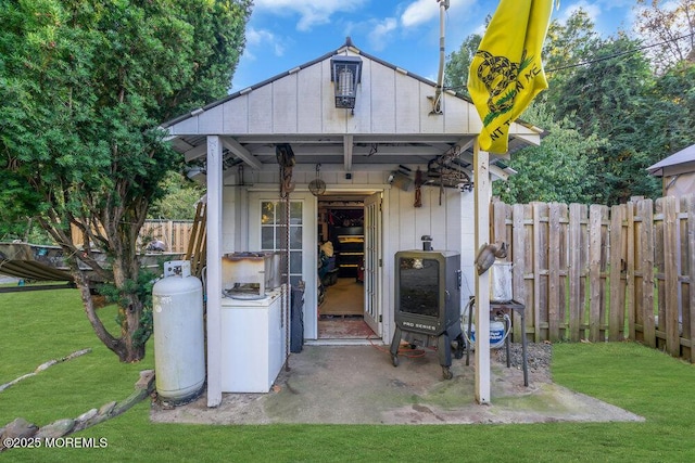 view of outbuilding with a lawn