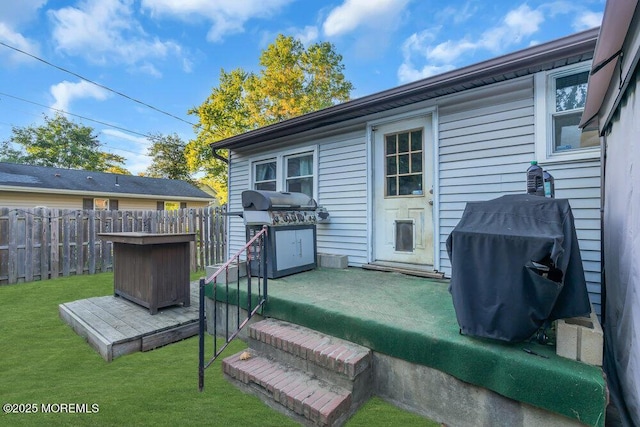 rear view of house with a yard