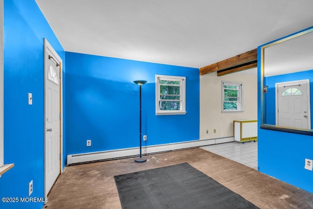 workout room with baseboard heating