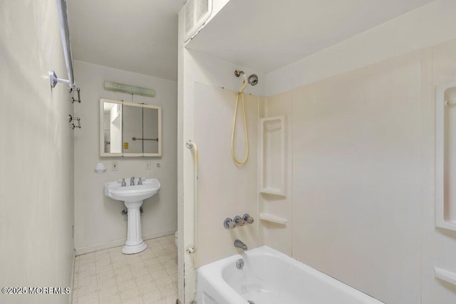 bathroom with shower / bathing tub combination