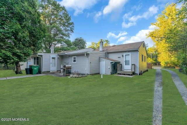 back of house with a yard