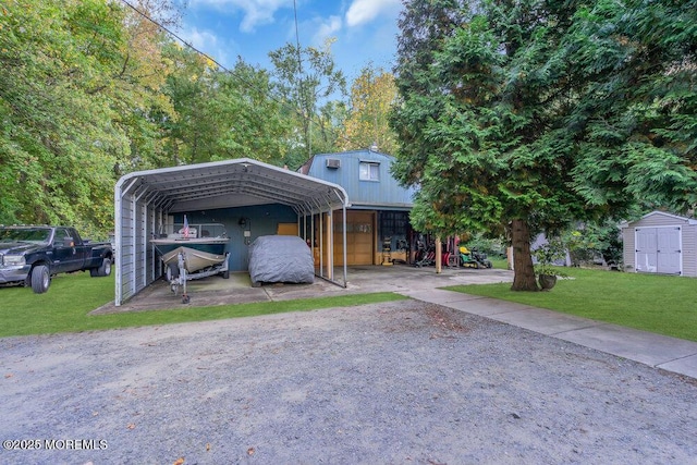 view of front of property with a front lawn, a carport, and a storage shed