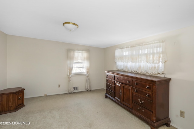 interior space featuring light carpet