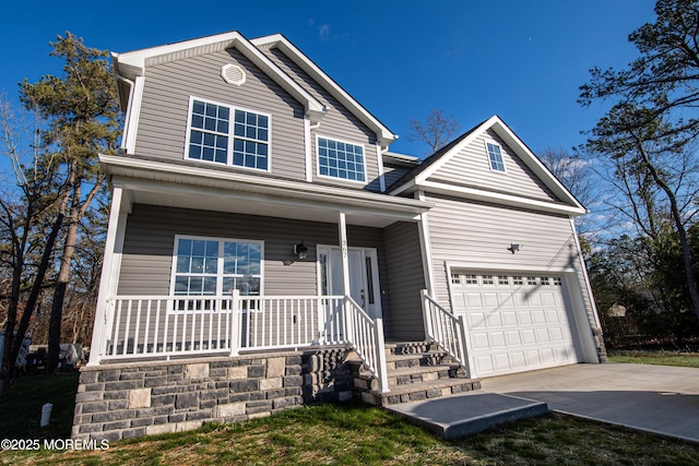 view of front facade with a garage and a porch