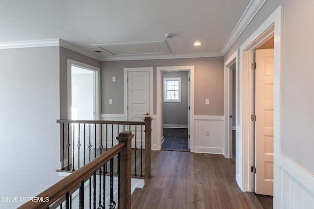 hall with dark wood-type flooring and crown molding