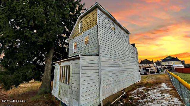 view of property exterior at dusk