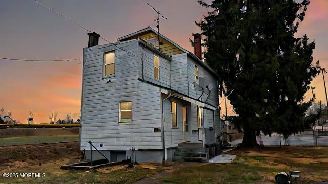 view of property exterior at dusk