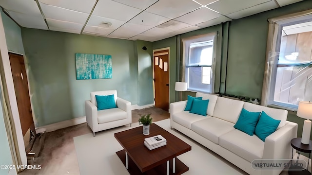 sitting room featuring a drop ceiling