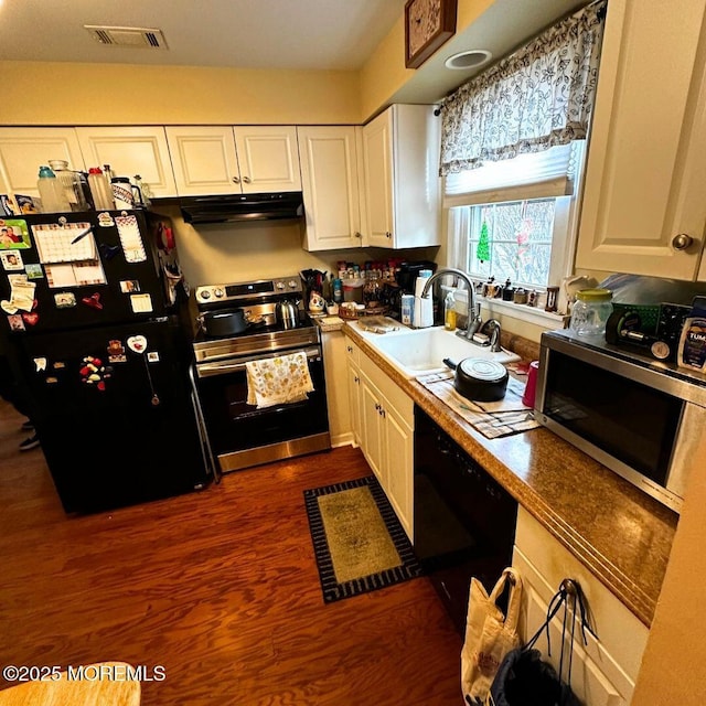 kitchen with sink, white cabinetry, black appliances, and dark hardwood / wood-style floors