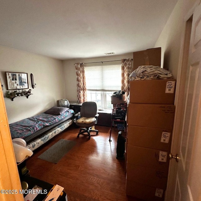 bedroom featuring hardwood / wood-style flooring