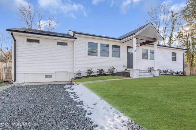 ranch-style house featuring a front lawn