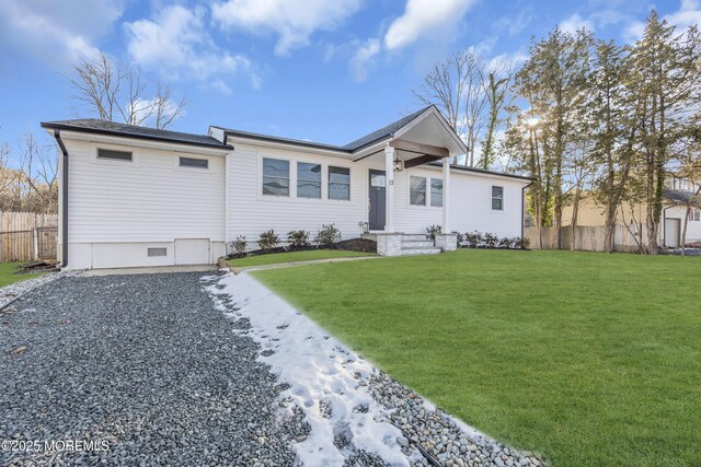 ranch-style home featuring a front yard