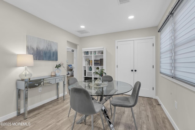 dining space featuring light hardwood / wood-style flooring