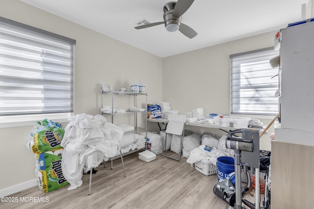 interior space featuring ceiling fan and light hardwood / wood-style flooring