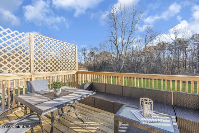 wooden deck featuring an outdoor hangout area