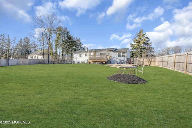 view of yard with a wooden deck