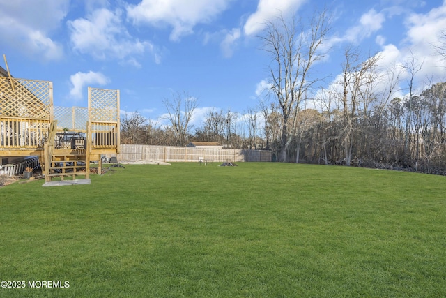 view of yard featuring a wooden deck