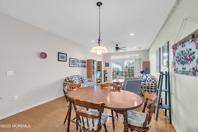 dining area featuring light wood-type flooring and ceiling fan