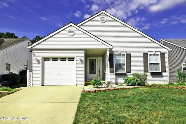 view of front of home featuring a front yard and a garage