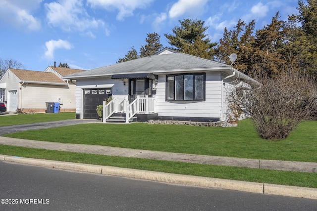 view of front of home with a garage and a front yard