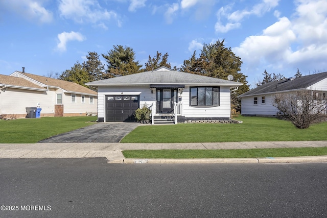 single story home with a front lawn and a garage